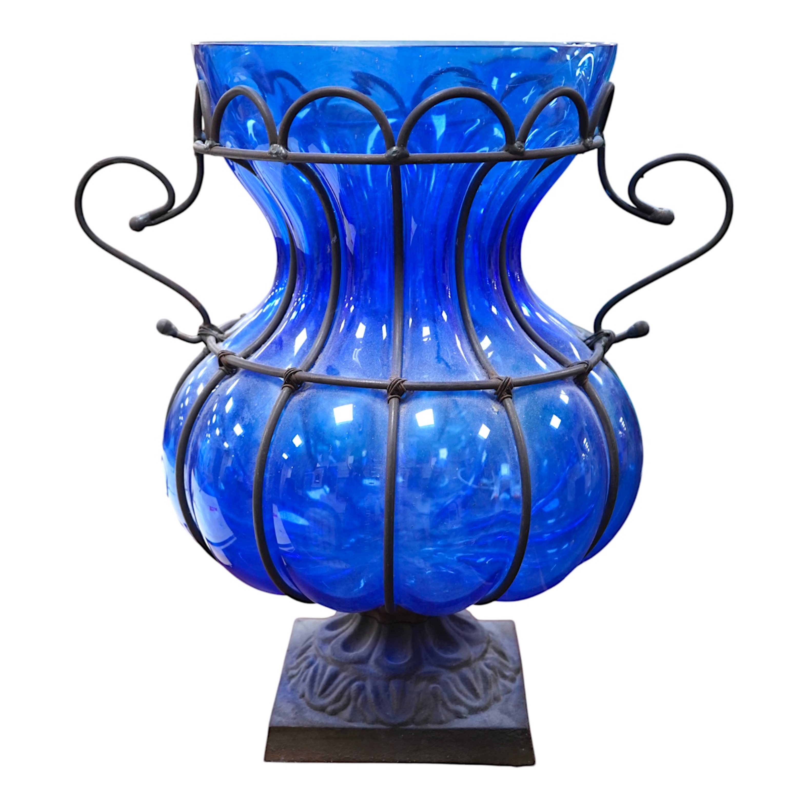 A wrought and cast iron mounted large blue glass vase, 49cm. Condition - would benefit from a clean, otherwise good